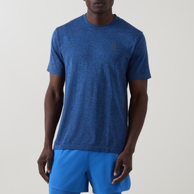 Model wearing On Running T-Shirt in Jay Heather, styled with bright blue shorts