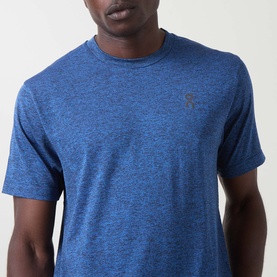 Model wearing On Running T-Shirt in Jay Heather, crew neck with small logo detail on chest, lightweight marl fabric
