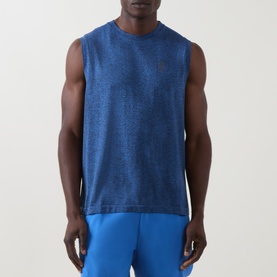 Model wearing On Running Jay Heather sleeveless performance T-shirt, styled with bright blue shorts.