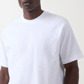 Model wearing On Running white crew neck T-shirt with small logo embroidery at chest, 100% cotton fabric
