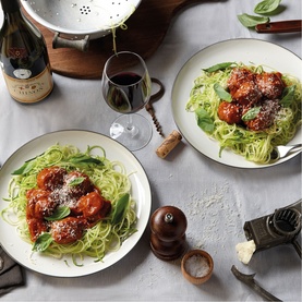 Royal Doulton white Kitchenware Dinner Bowls styled with courgetti and meatballs in tomato sauce, red wine glass and pepper mill on grey linen