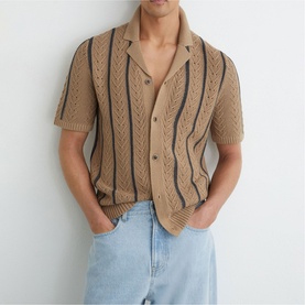 Model wearing Reiss light camel open-knit short-sleeve shirt with navy stripe detail and button front, styled with light wash jeans