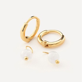 Juvi gold hoop earrings with detachable white bead charms, shown as a set of four pieces on white background