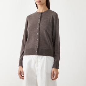 Model wearing Selected Femme wool cardigan in Delicioso brown, round neck, button front, styled with white wide-leg trousers