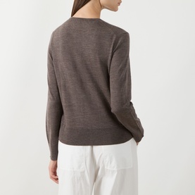 Model wearing Selected Femme knit in Delicioso, back view, 100% wool long-sleeve jumper with ribbed cuffs, styled with white trousers