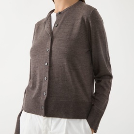 Model wearing Selected Femme Delicioso wool cardigan with button-front fastening and collarless neckline, styled with white trousers