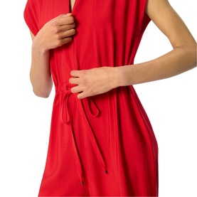 Model wearing Whistles red sleeveless dress with V-neckline and drawstring waist tie detail.