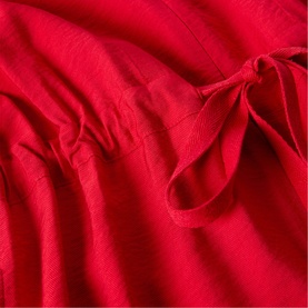 Whistles red womenswear dress close-up showing fabric texture and self-tie bow waist detail