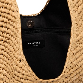 Whistles beige raffia bag interior showing black fabric lining, zip pocket, and branded label