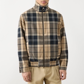 Model wearing Barbour Birchwood Dress Tartan Casual Jacket in beige and navy check, styled with stone chinos.