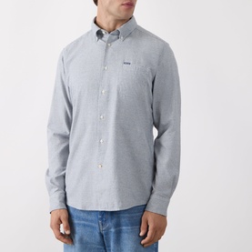 Model wearing Barbour navy casual shirt in cotton Oxford fabric with button-down collar and chest pocket, styled with blue jeans