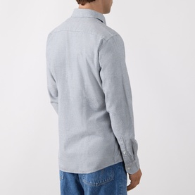 Model wearing Barbour navy cotton casual shirt, rear view, styled with blue jeans