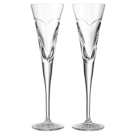 Waterford clear crystal champagne flutes, pair, with engraved heart motif and elongated stem, on white background