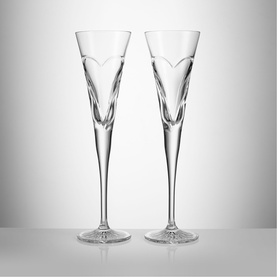 Waterford clear crystal champagne flute pair with etched heart motif, long slender stems and star-cut bases