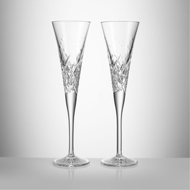 Waterford clear crystal champagne flute glasses, pair, with intricate cut diamond pattern detailing on the bowl and base