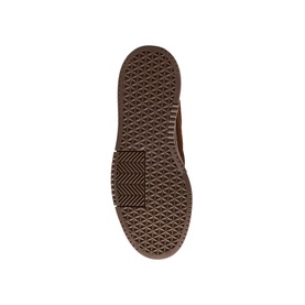 Steve Madden brown men's shoe sole detail, showing textured rubber outsole with geometric waffle-grip pattern in tan and dark brown tones.