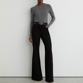 Model wearing Reiss grey marl ribbed long-sleeve top, styled with black flared trousers and a brown leather belt.