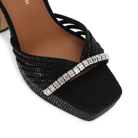 Kurt Geiger London black glitter strappy heeled sandal with crystal-embellished toe strap and square open toe, close-up detail shot