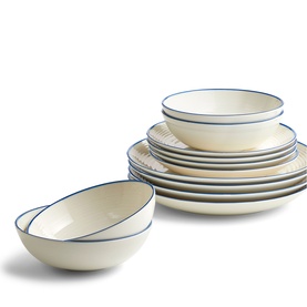 Gordon Ramsay cream dinnerware set with blue rim detail, including plates, side plates and bowls, stacked together