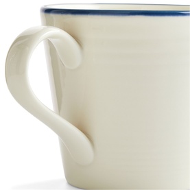 Gordon Ramsay mug in cream with blue rim detail, curved handle, close-up view showing texture and craftsmanship