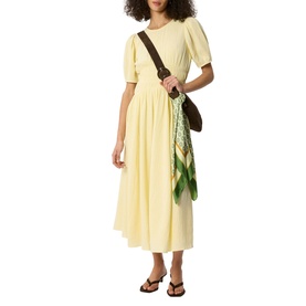 Model wearing Whistles yellow midi dress with puff sleeves and pleated skirt, styled with brown crossbody bag and printed scarf