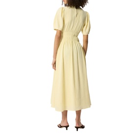 Model wearing Whistles yellow midi dress with puff sleeves, gathered waist, and full skirt, styled with black heeled sandals.
