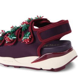 Kurt Geiger London red chunky slingback trainers with floral berry embellishments, lace-up front, and cream chunky sole, rear angle view