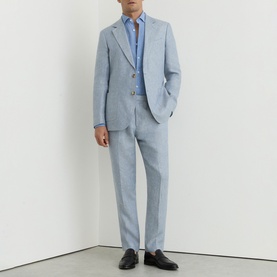 Model wearing Reiss soft blue suit with matching blazer and trousers, styled with a blue shirt and black leather shoes.