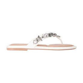 White flat thong sandal with silver star and floral embellishments at toe post, nude insole, flat sole