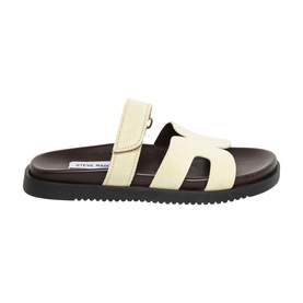 Steve Madden Missile Flat Sandals in yellow suede with adjustable strap, cushioned footbed, and dark contrast sole