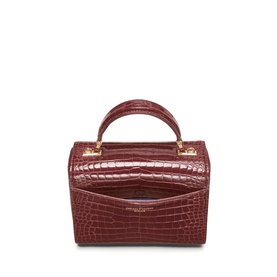 Aspinal of London merlot croc-effect structured top-handle bag with gold hardware and front slip pocket, rear view.