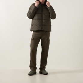 Model wearing North Face New Taupe Green quilted casual jacket, styled with matching cargo trousers and dark boots.