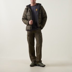 Model wearing North Face New Taupe Green puffer jacket with hood, styled with dark navy tee, khaki cargo trousers and green trainers.