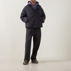 Model wearing North Face Obsidian casual jacket styled with purple hoodie and dark grey trousers