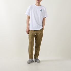 Model wearing North Face TNF White Crew Neck T with small Pacific Teal chest graphic, styled with khaki trousers and grey trainers