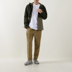 Model wearing North Face TNF White Crew Neck T-Shirt, styled with olive hooded jacket, tan trousers and grey trainers.