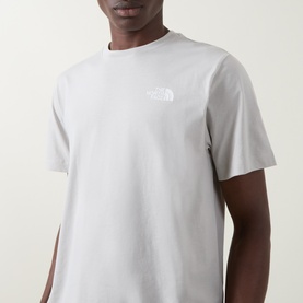 Model wearing North Face Evolution Box Logo Back Graphic T-Shirt in Cumulus Cloud, crew neck, short sleeves with chest logo detail