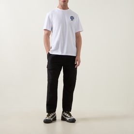 Model wearing North Face TNF White crew neck cotton T-shirt with small chest graphic, styled with black cargo trousers and trail trainers.