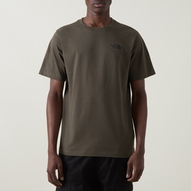 Model wearing North Face Yosemite Oak Logo Back Graphic T-Shirt in New Taupe Green, crew neck, short sleeves, with black trousers.