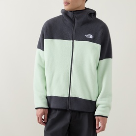 Model wearing North Face fleece zip-up hoodie in Calcified Lime and Anthracite colourblock with logo chest badge, styled with matching joggers.