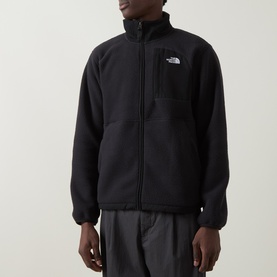 Model wearing North Face Yumiori Half-Zip Fleece Sweatshirt in TNF Black, full-zip style with chest pocket and embroidered logo, styled with grey