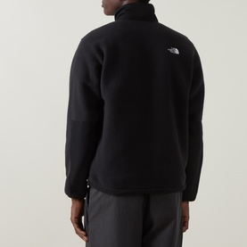 Model wearing North Face Yumiori Half-Zip Fleece Sweatshirt in TNF Black, rear view showing embroidered logo and zipped chest pocket.