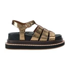 Kurt Geiger London gold metallic leather gladiator platform sandals with ankle strap, buckle detail, and black chunky sole
