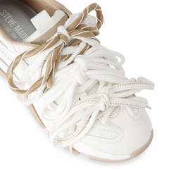 Steve Madden white leather lace-up trainers with layered tan ribbon laces and beige rubber sole, close-up detail view