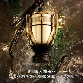 Paco Rabanne Invictus Elixir Parfum in trophy-shaped gold and black bottle, surrounded by cypress and vanilla elements
