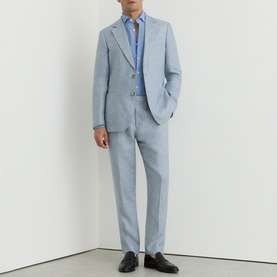 Model wearing Reiss soft blue suit with matching trousers and blazer, styled with a blue shirt and dark loafers