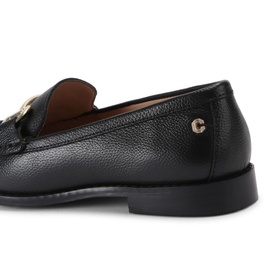 Black pebbled leather loafer with gold-tone C logo hardware, low heel, and black sole, shown from rear three-quarter angle.