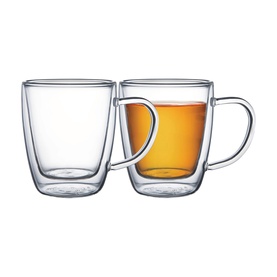 Pair of clear double-walled glass mugs with handles, one empty and one filled with amber tea, shown on white background