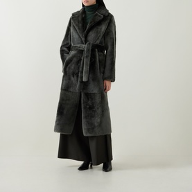 Model wearing Yves Salomon Long Belted Shearling Coat in grey, notched lapel, self-tie belt, long silhouette