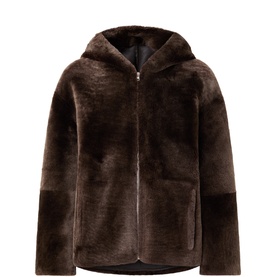 Yves Salomon shearling coat in Autumn brown with hood, zip fastening, and relaxed silhouette